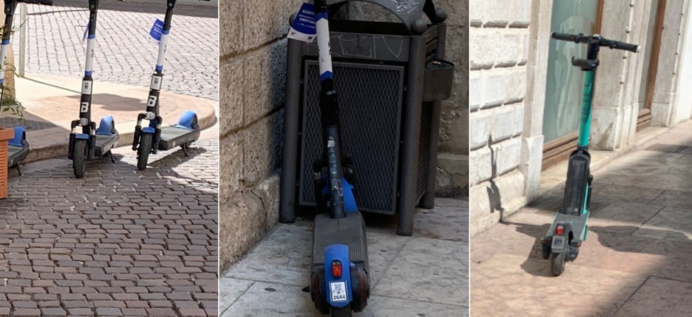Monopattini abbandonati su marciapiedi e strade, tra difficoltà dei pedoni e problemi dei negozi