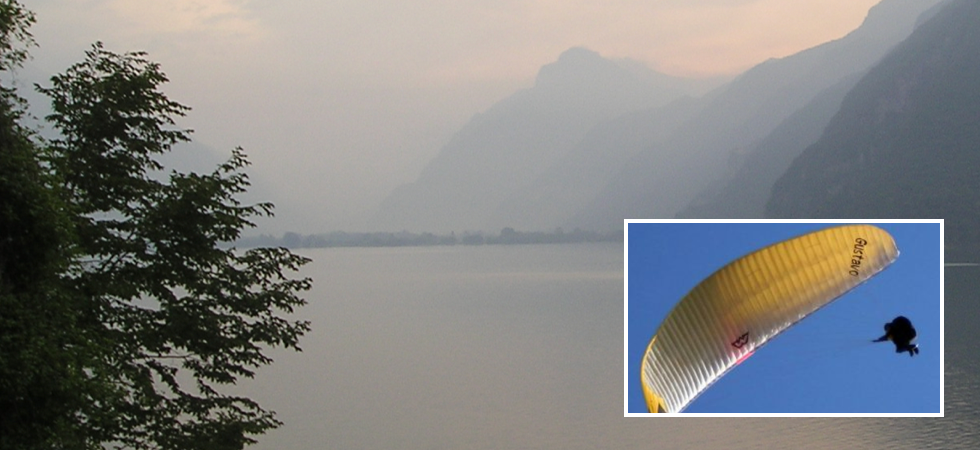 Foto sullo sfondo da Wikipedia Perde il controllo del parapendio e precipita nel lago: soccorsi in azione