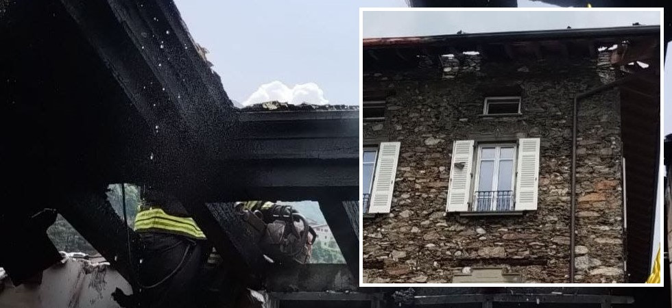 In fiamme il tetto di una palazzina a tre piani: massiccio intervento dei vigili del fuoco