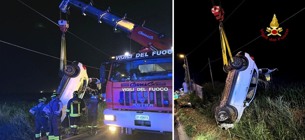 Perde il controllo dell'auto, esce di strada e si ribalta in un canale