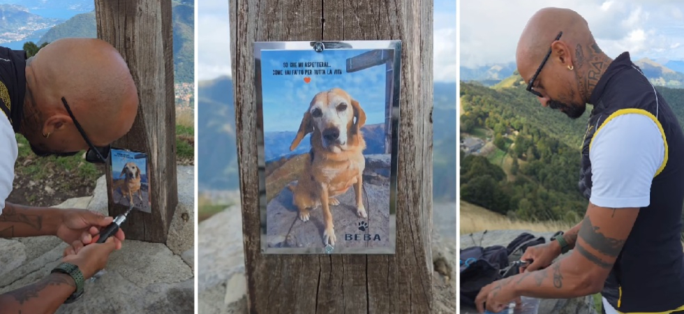 Raggiunge la croce di vetta per rendere omaggio alla sua cagnolona