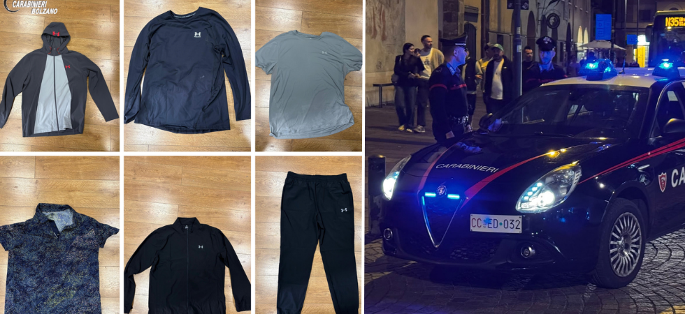Ruba capi d'abbigliamento in un negozio del centro commerciale e spintona i vigilanti per scappare