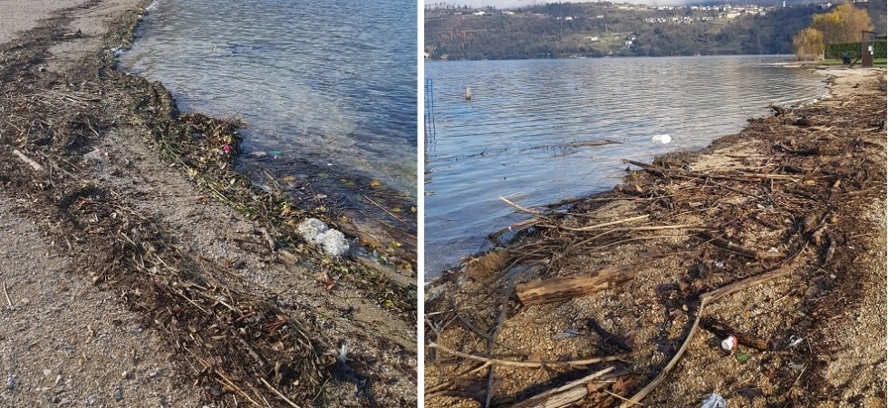 Calceranica, l'acqua alta si ritira e lascia sulla spiaggia legno e rifiuti di ogni genere